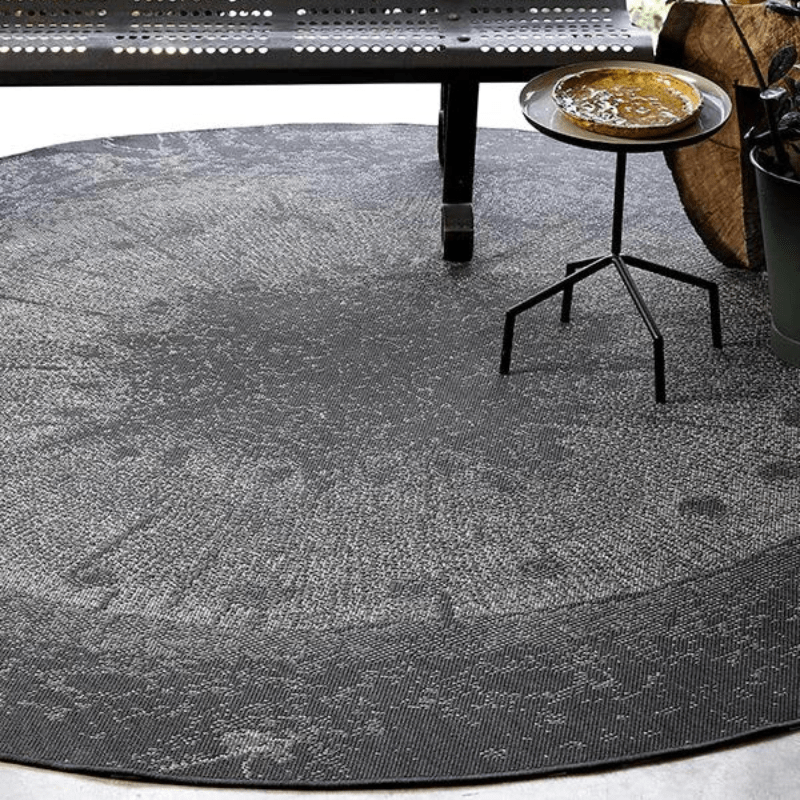 https://www.lcvdesignsndecor.co.za/shop/decor/rugs/round-rugs/indoor-and-outdoor-round-rugs/dichotomized-slate-rug/ Dichotomized Slate Rug Lifestyle Image